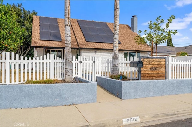 view of front of house with solar panels