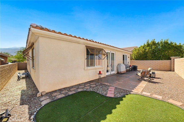 rear view of house with a patio