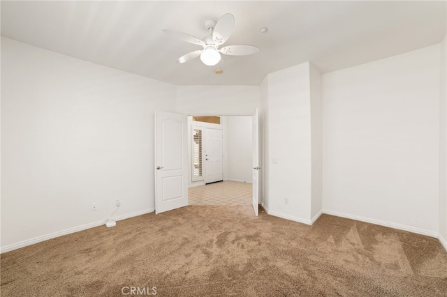 carpeted empty room featuring ceiling fan