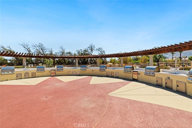 view of community featuring exterior kitchen