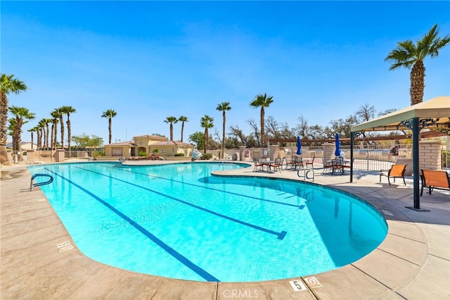 view of swimming pool with a patio area