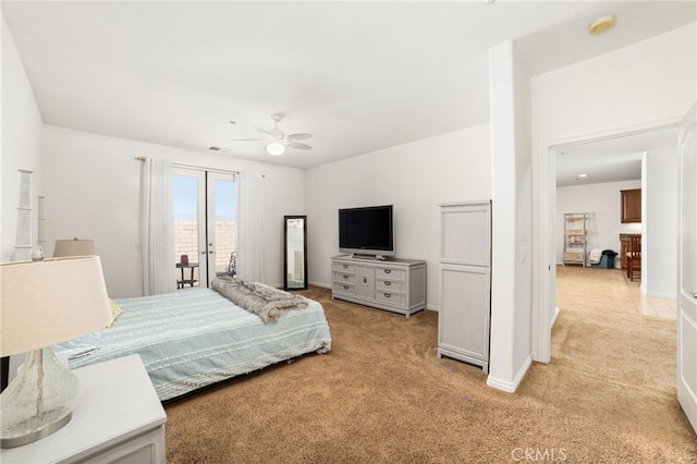 carpeted bedroom featuring access to exterior and ceiling fan