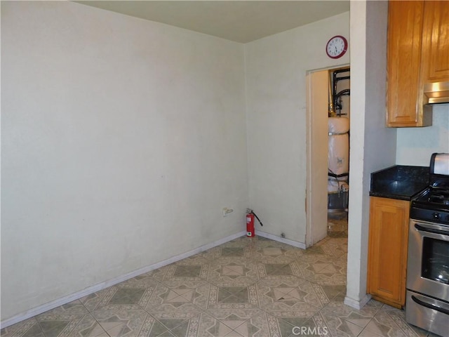 kitchen with exhaust hood and stainless steel range oven