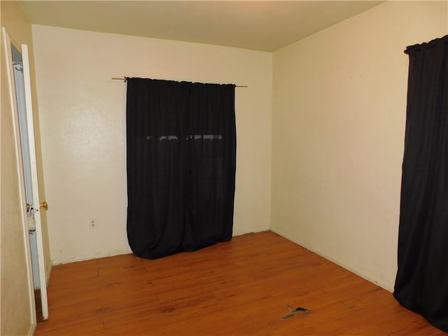 unfurnished room featuring light hardwood / wood-style floors