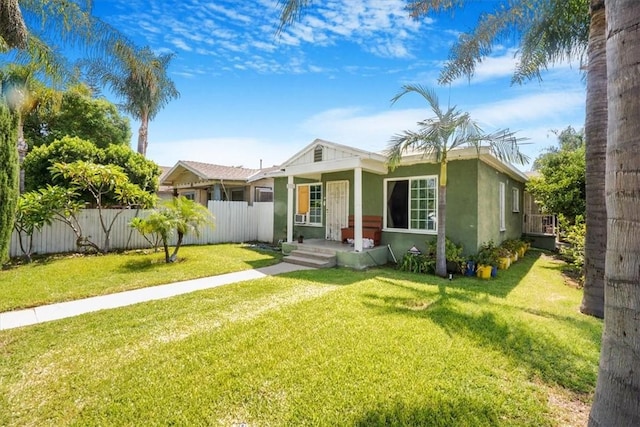 bungalow-style home featuring a front yard