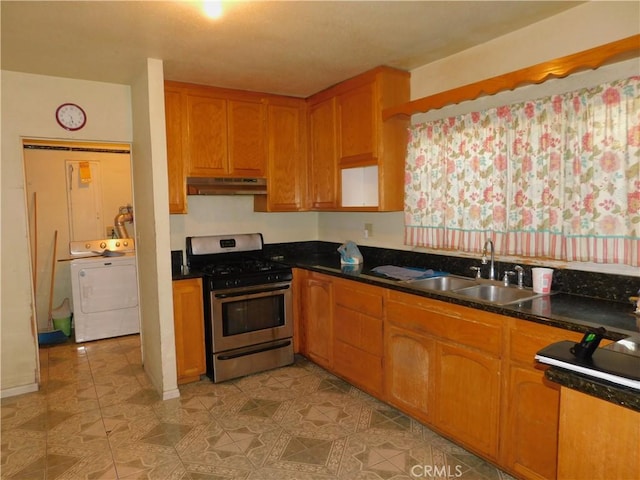 kitchen with gas stove, washer / dryer, and sink