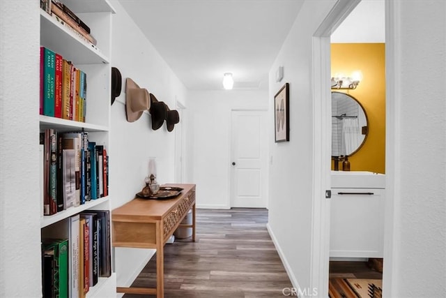 hallway featuring dark hardwood / wood-style flooring and sink