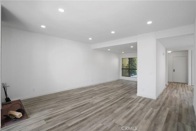 empty room with light hardwood / wood-style floors