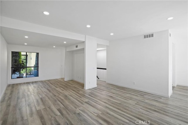 unfurnished room featuring light hardwood / wood-style floors