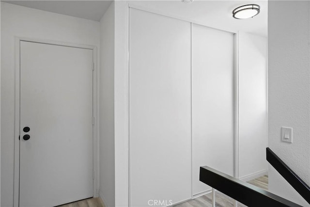 bathroom with wood-type flooring