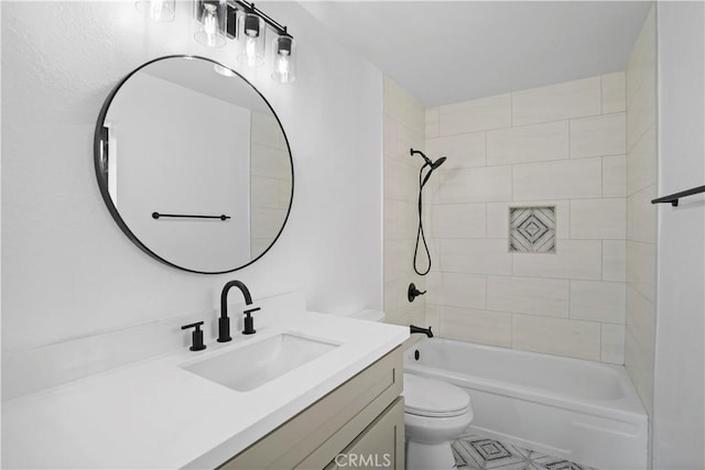 full bathroom featuring toilet, vanity, and tiled shower / bath