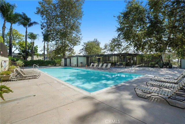 view of swimming pool featuring a patio