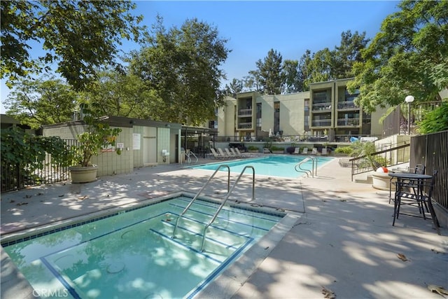 view of swimming pool with a patio area