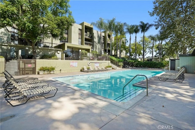 view of pool featuring a patio area