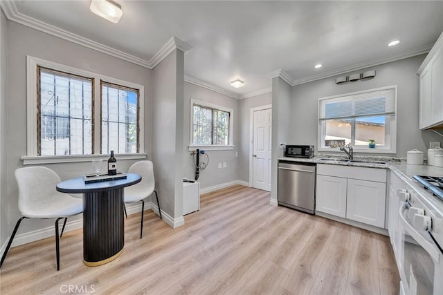 kitchen featuring dishwasher, white cabinets, sink, light hardwood / wood-style flooring, and ornamental molding