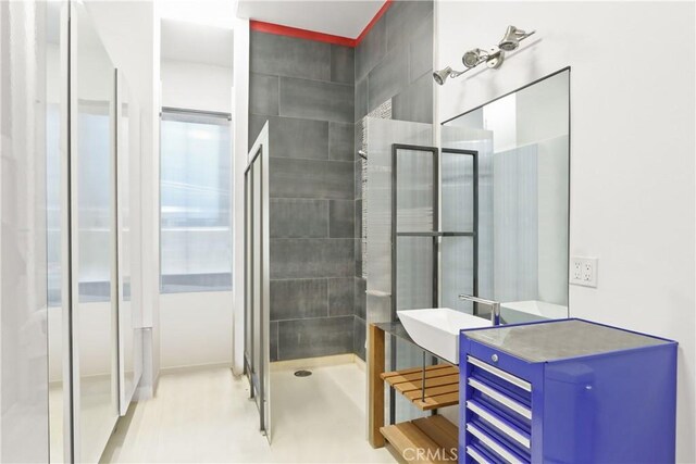 bathroom with sink and walk in shower