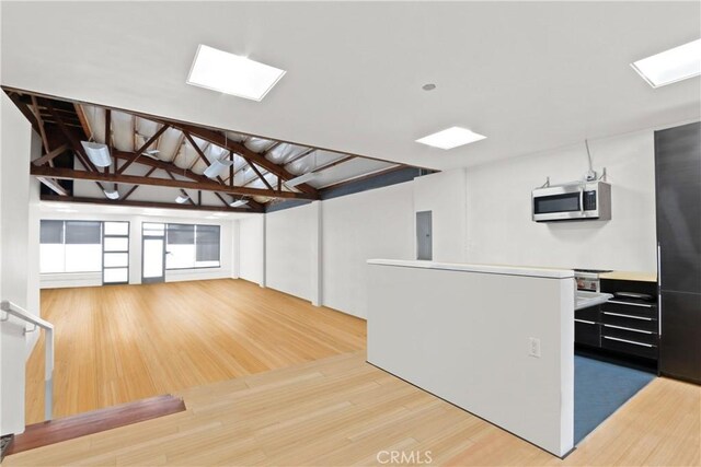 kitchen featuring white cabinets and light wood-type flooring