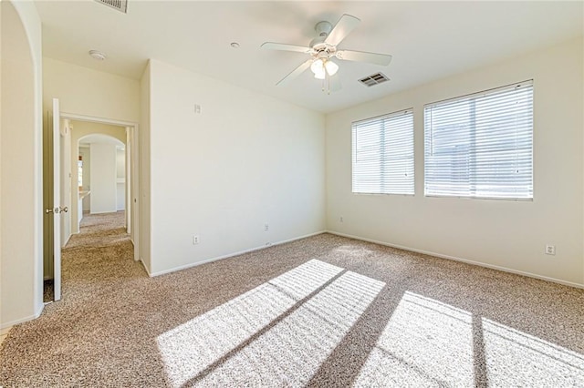 unfurnished bedroom featuring light carpet and ceiling fan