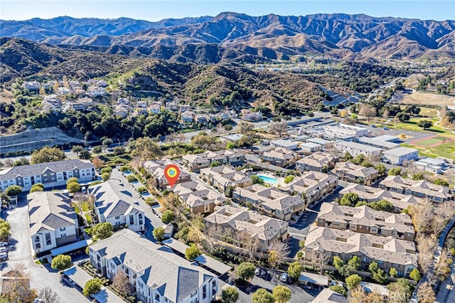 birds eye view of property with a mountain view