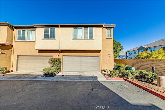 townhome / multi-family property featuring a garage