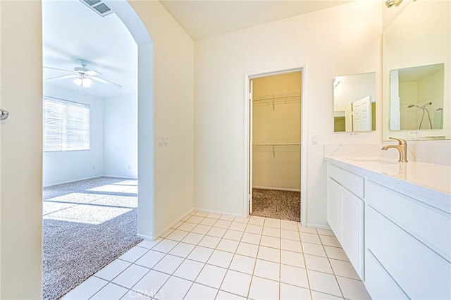 bathroom featuring ceiling fan, tile patterned flooring, and vanity