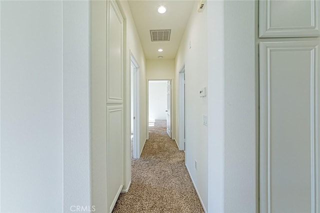 hallway with light carpet