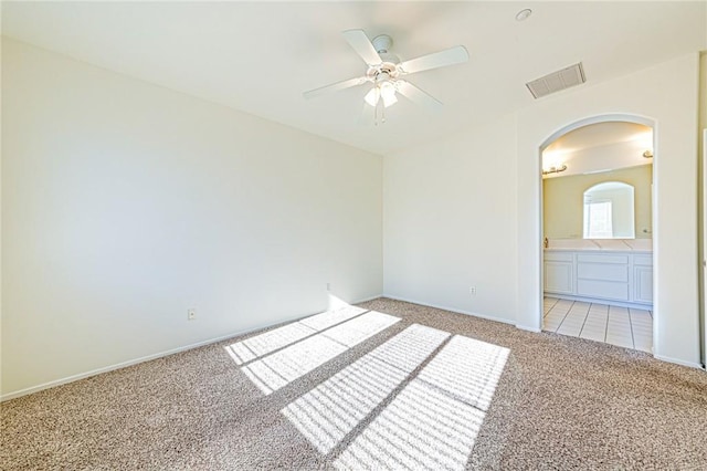 carpeted empty room with ceiling fan