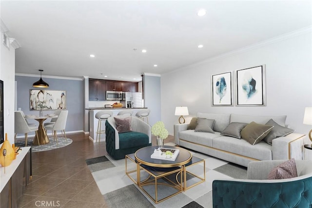 living room featuring dark tile patterned floors and ornamental molding