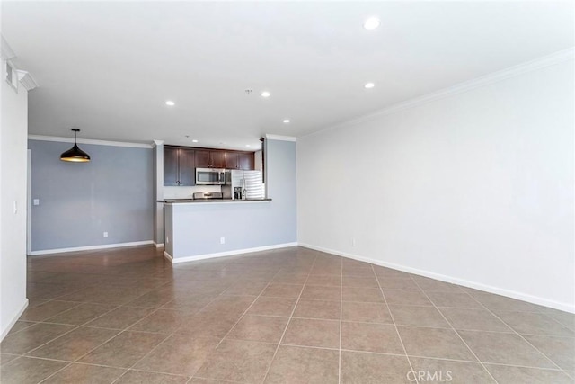 unfurnished living room featuring ornamental molding and light tile patterned floors