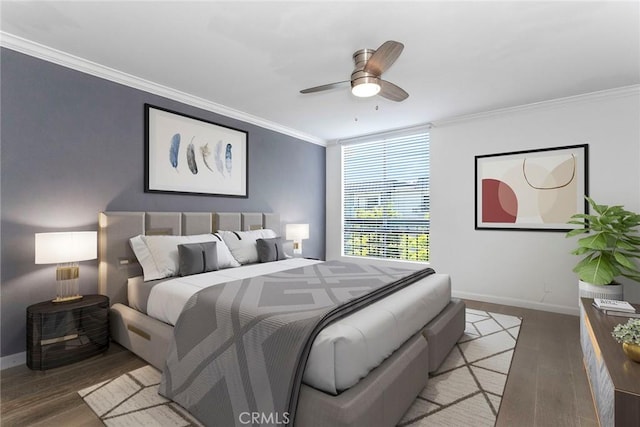 bedroom with hardwood / wood-style floors, ceiling fan, and crown molding