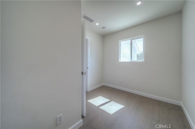15570 Ethel St, Chino Hills, CA 91709 - empty room with light wood finished floors, recessed lighting, visible vents, and baseboards