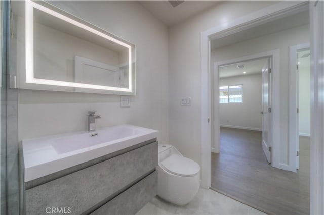 15570 Ethel St, Chino Hills, CA 91709 - half bathroom with toilet, vanity, and baseboards