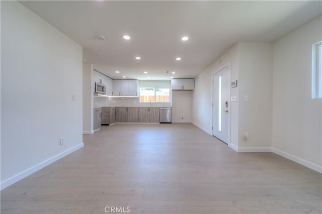 15570 Ethel St, Chino Hills, CA 91709 - unfurnished living room with recessed lighting, baseboards, and light wood finished floors