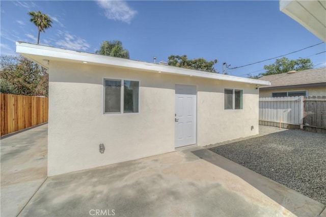 15570 Ethel St, Chino Hills, CA 91709 - rear view of property featuring stucco siding, a fenced backyard, and a patio