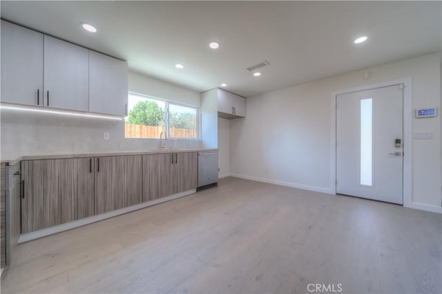 15570 Ethel St, Chino Hills, CA 91709 - kitchen featuring light wood finished floors, recessed lighting, light countertops, visible vents, and stainless steel dishwasher