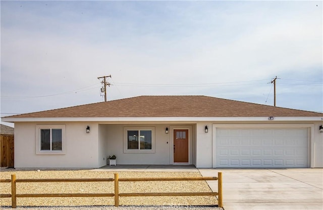 ranch-style home featuring a garage