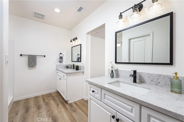 bathroom featuring wood-type flooring and vanity