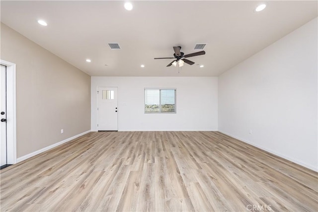 unfurnished living room featuring light wood-type flooring and ceiling fan