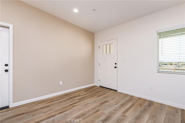 spare room with light wood-type flooring