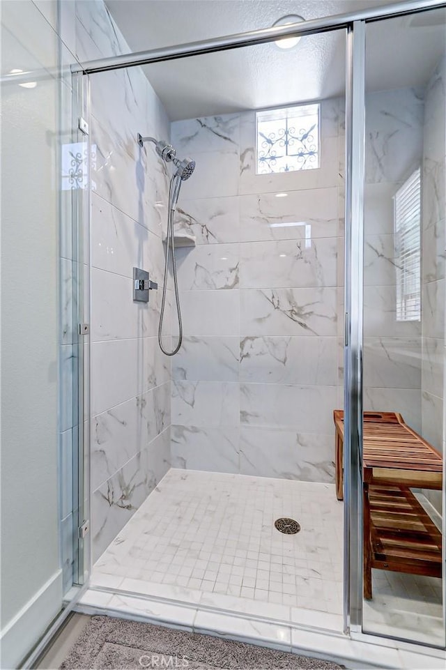 bathroom featuring an enclosed shower