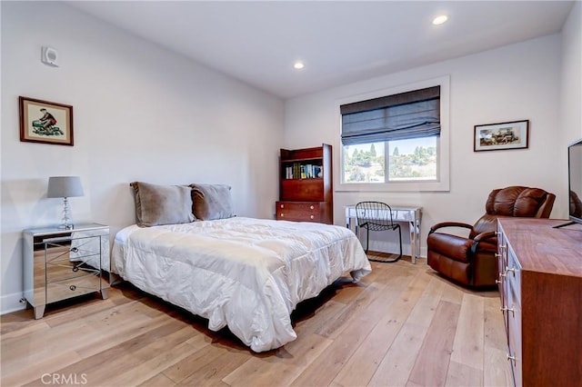 bedroom with light hardwood / wood-style floors