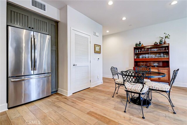 dining area with light hardwood / wood-style flooring