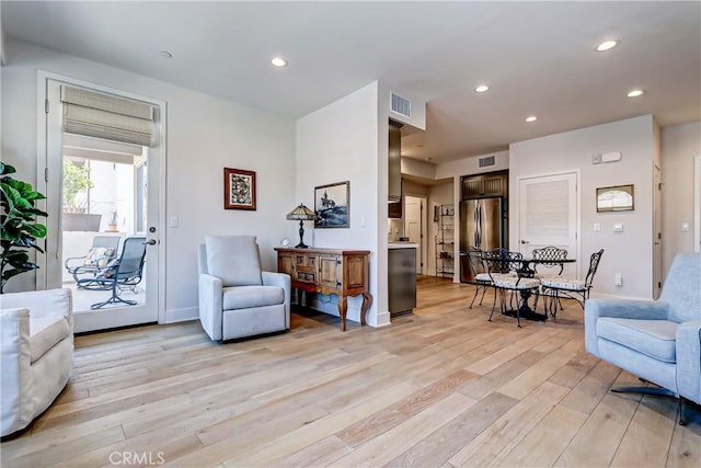 living room with light hardwood / wood-style flooring