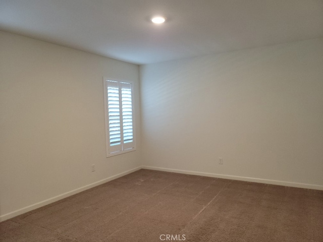 empty room featuring carpet flooring