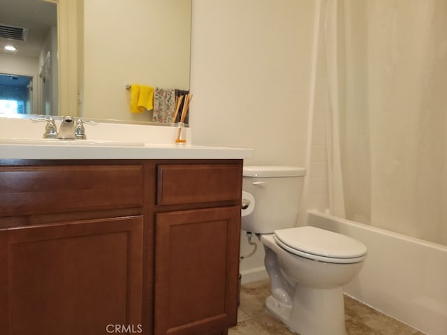 full bathroom with tile patterned flooring, shower / tub combo, vanity, and toilet