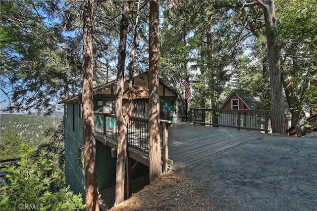 view of playground with a wooden deck