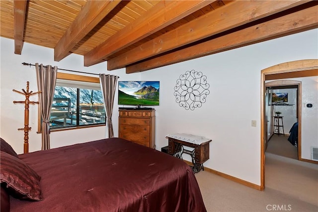 carpeted bedroom featuring wood ceiling and beamed ceiling