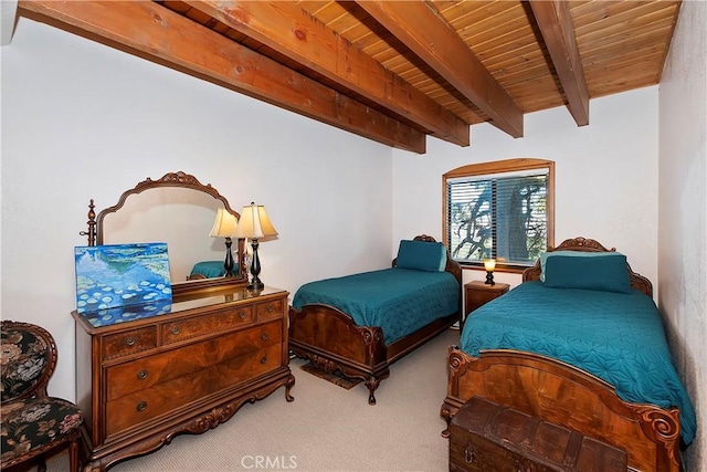 carpeted bedroom with beamed ceiling and wooden ceiling