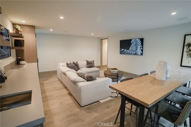 living room featuring recessed lighting and light wood-type flooring