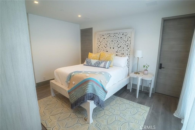 bedroom featuring wood finished floors